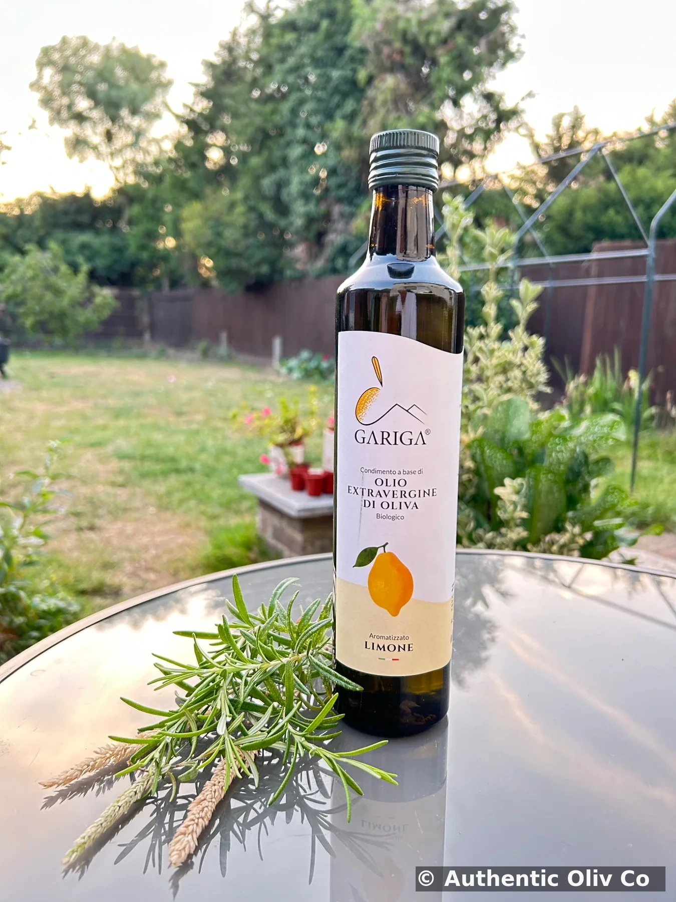 Gariga Limone olive oil in garden — original Authentic Oliv Co photograph